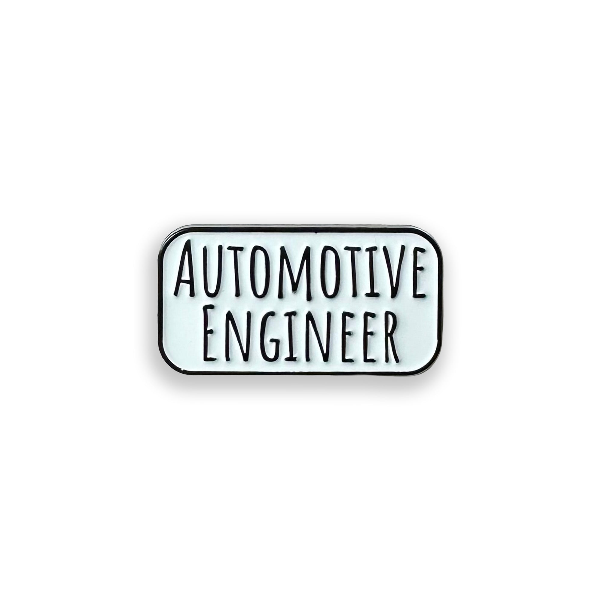 Enamel pin with the word automotive engineer on it, on a white background