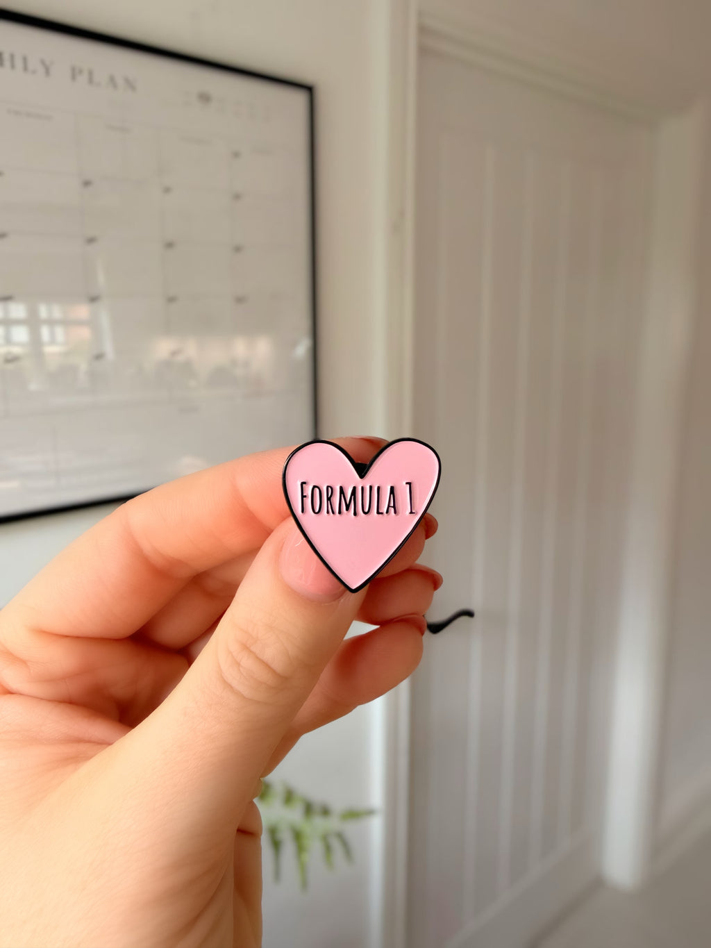 F1 love heart soft enamel pin badge — angled view
