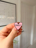 F1 love heart soft enamel pin badge — angled view
