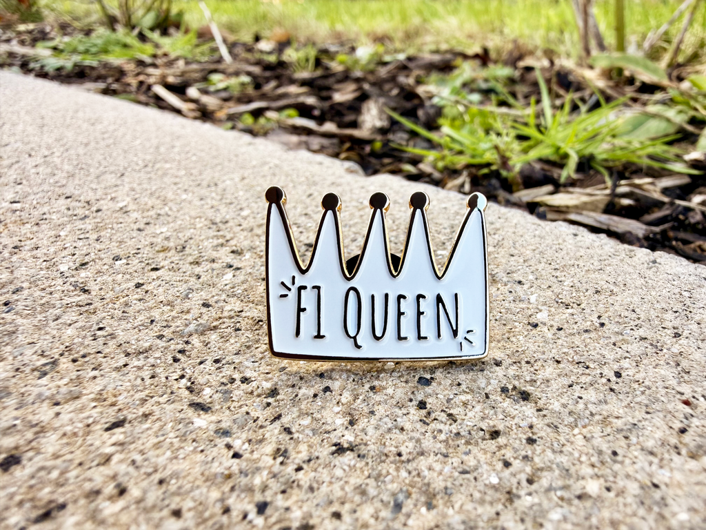 F1 Queen gold plated soft enamel pin badge — angled view