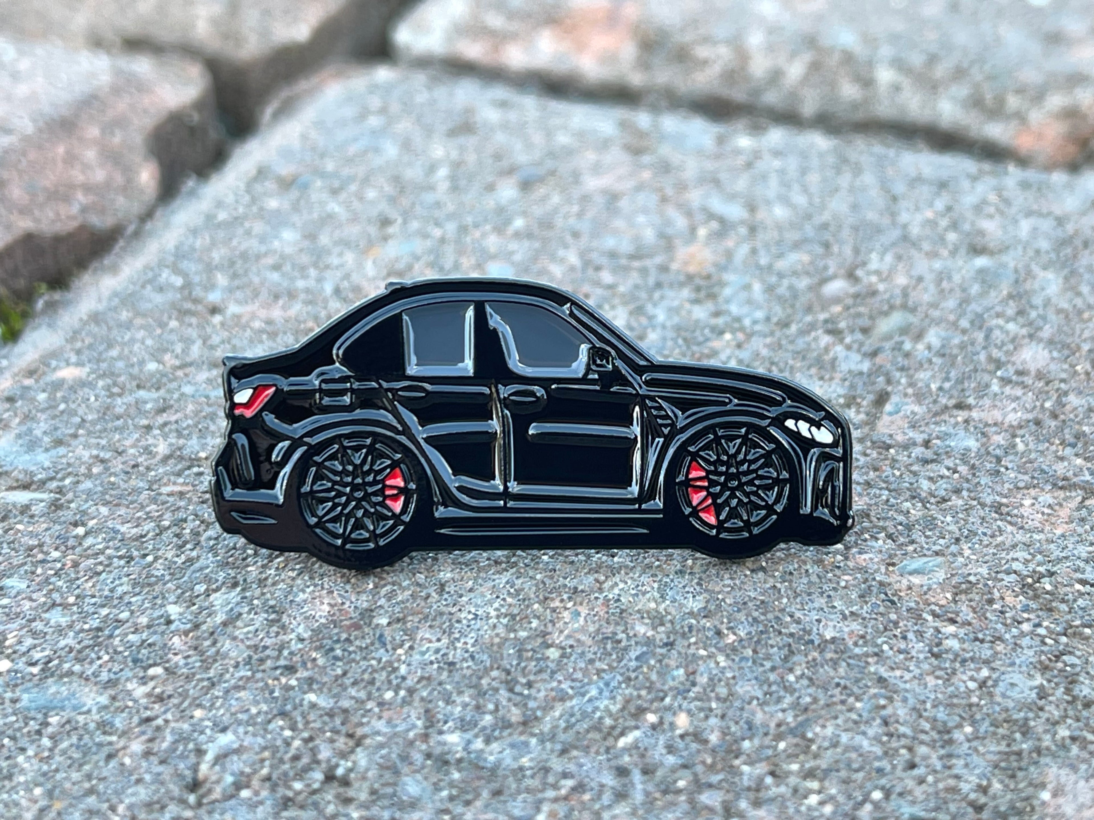 Sapphire Black BMW M3 G80 pin badge — detail view