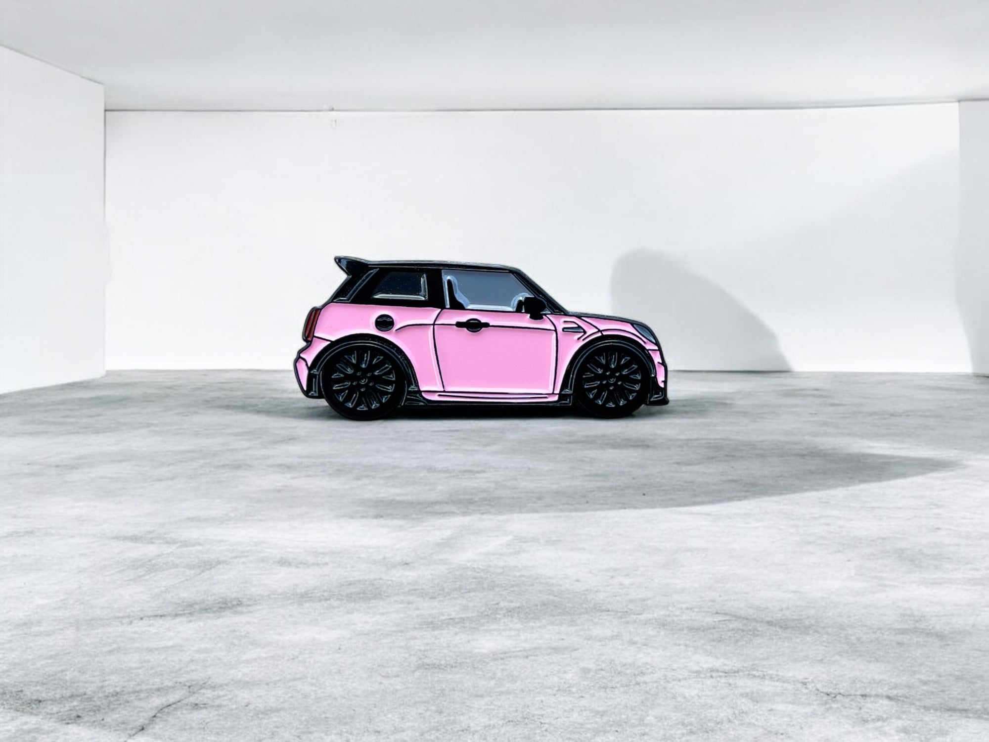 Pink MINI Cooper S JCW soft enamel pin badge — angled view