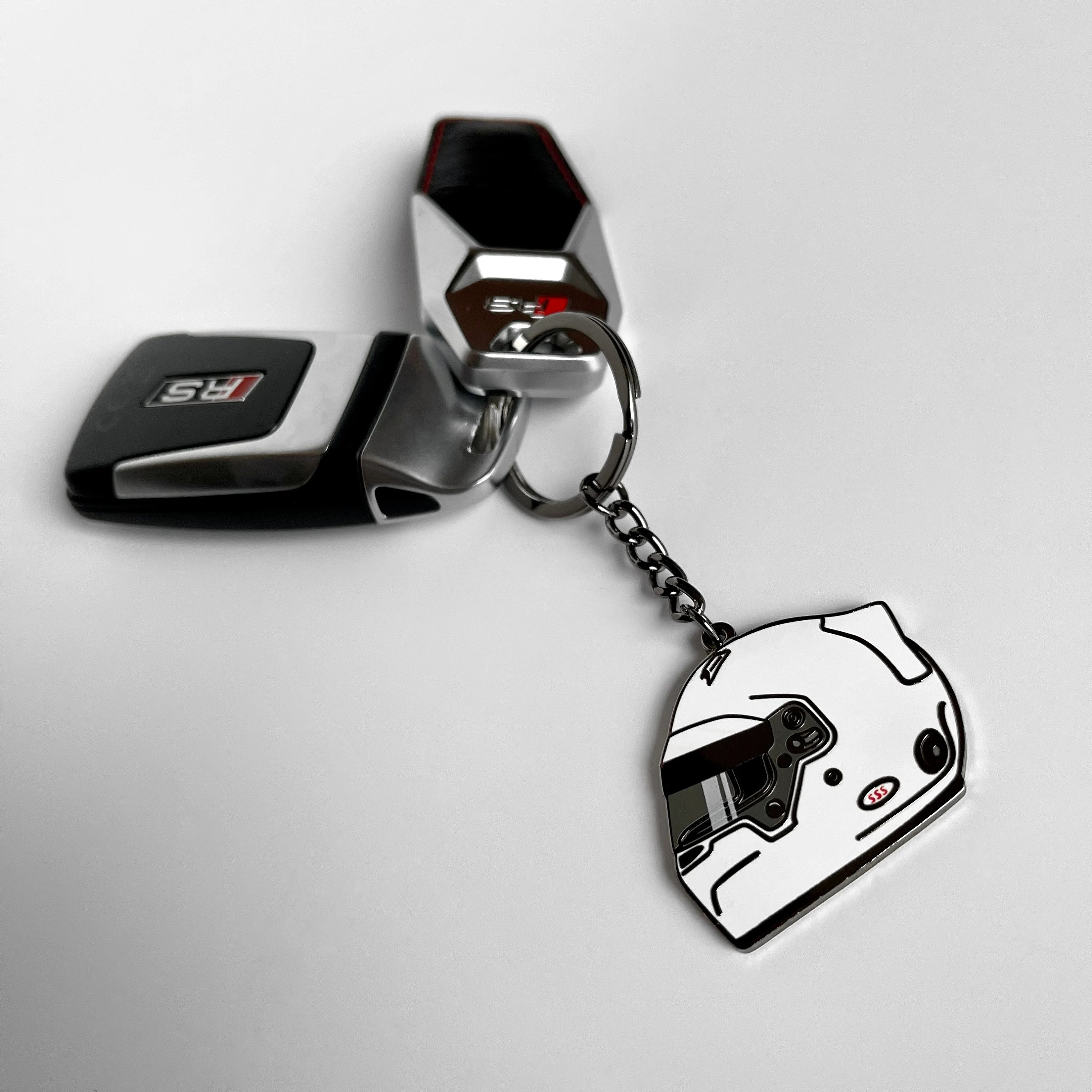 Classic racing helmet hard enamel keyring — angled view