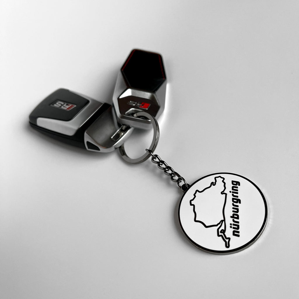 Nurburgring circuit outline hard enamel keyring — angled view