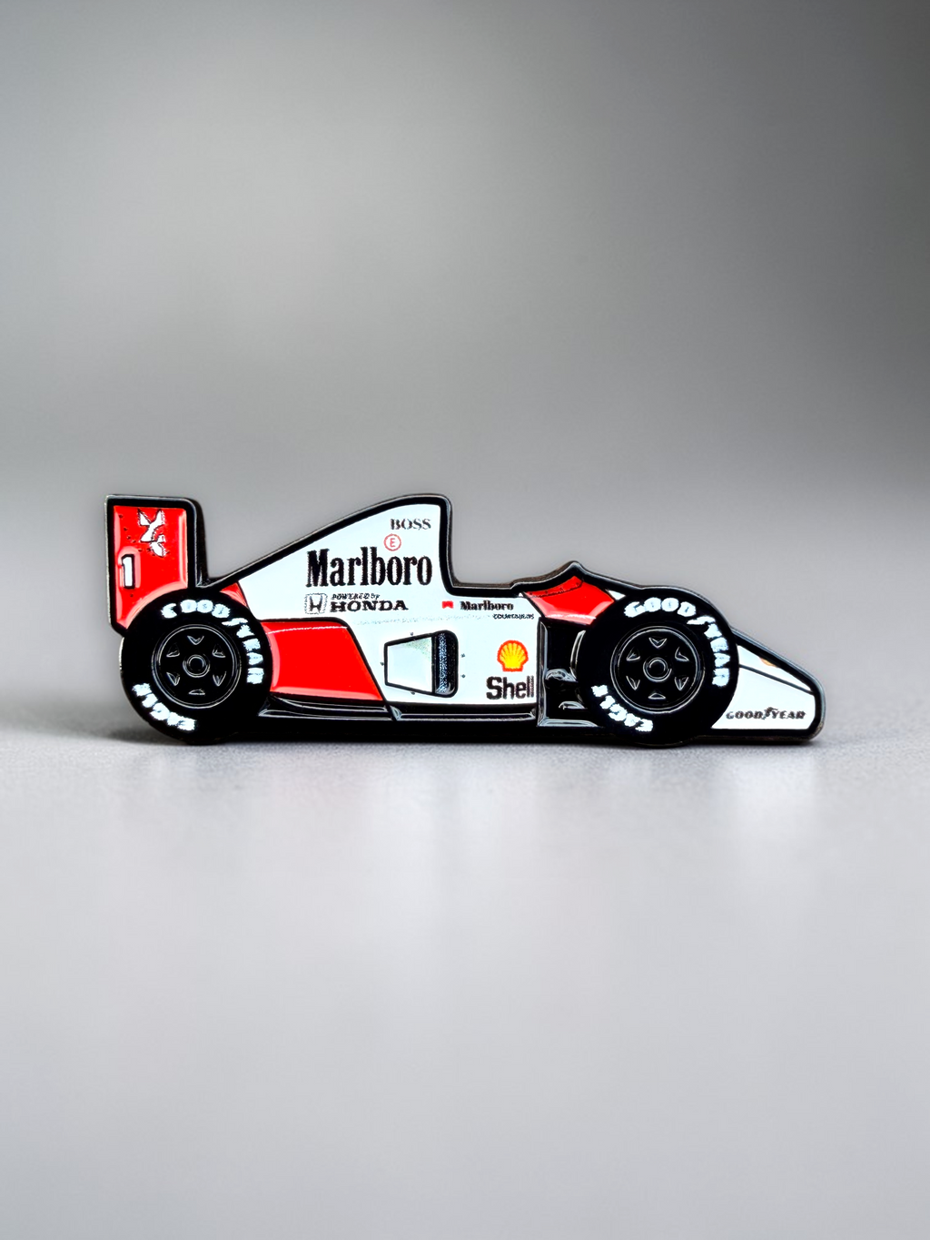 MP4/6 1991 Formula 1 car soft enamel pin — angled view
