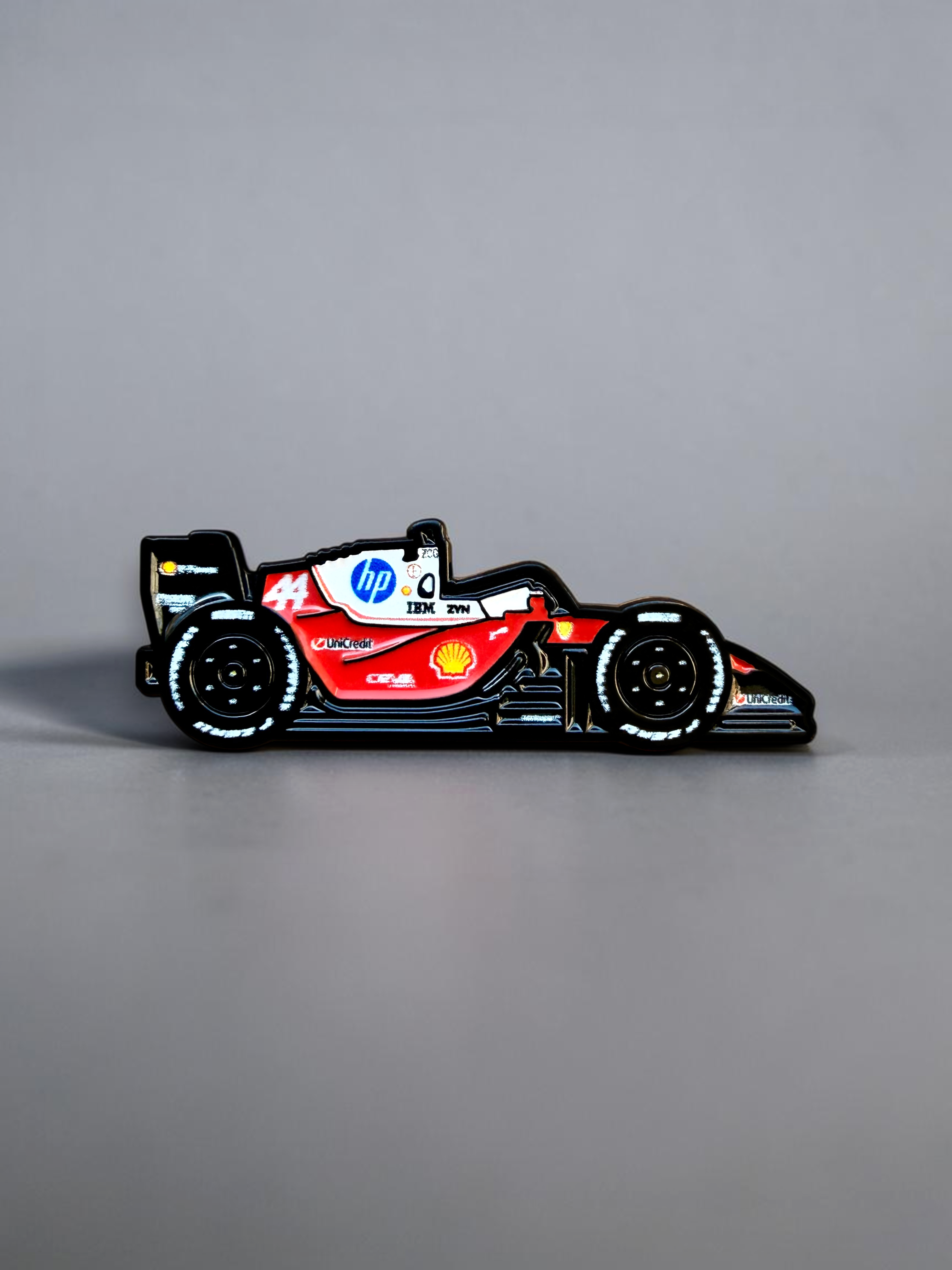 Ferrari SF-26 2026 F1 car soft enamel pin — angled view