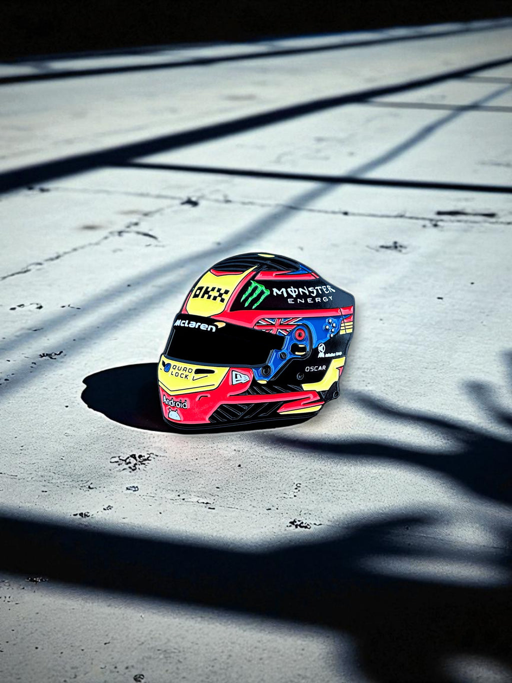 Oscar Piastri F1 helmet soft enamel pin badge — angled view